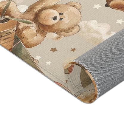 Nursery area rug in a tan, brown and cream palette