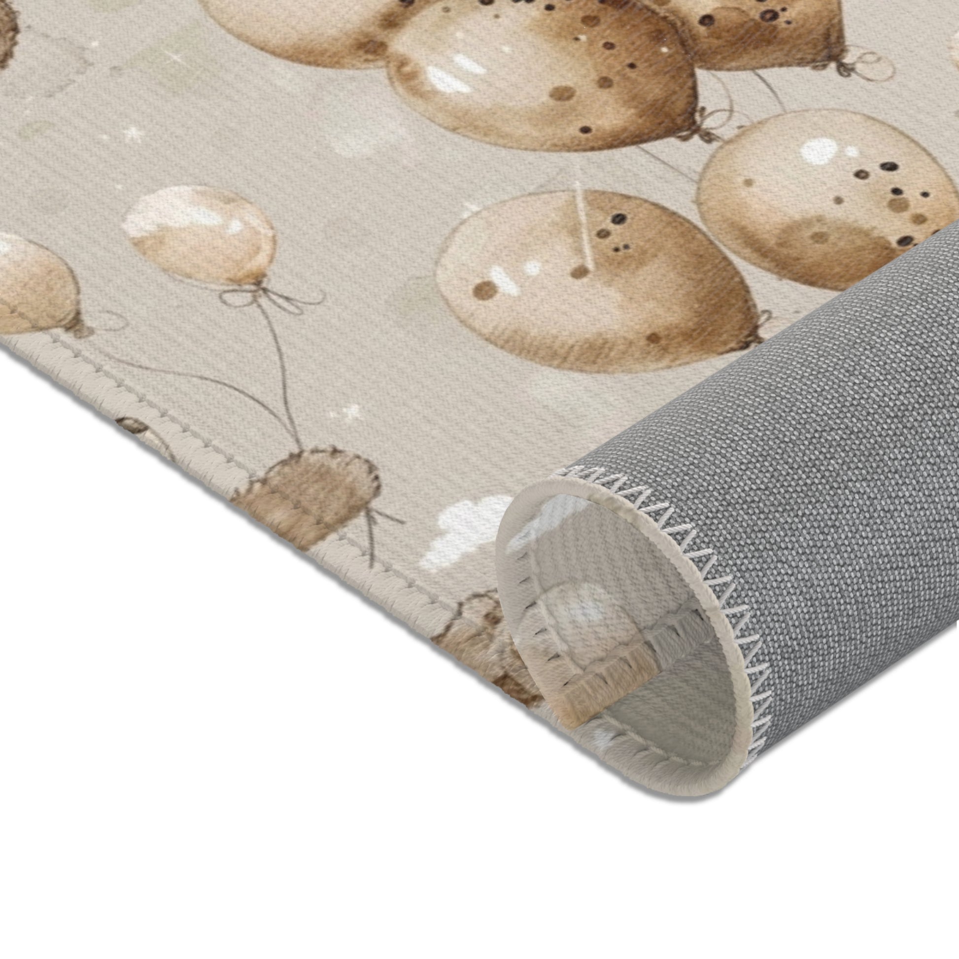 Corner detail of the Balloon Bears nursery area rug