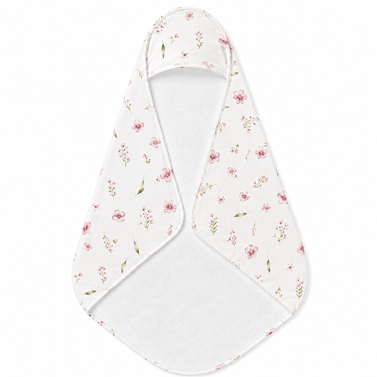 Blush Blossom hooded baby towel wrapped around a baby