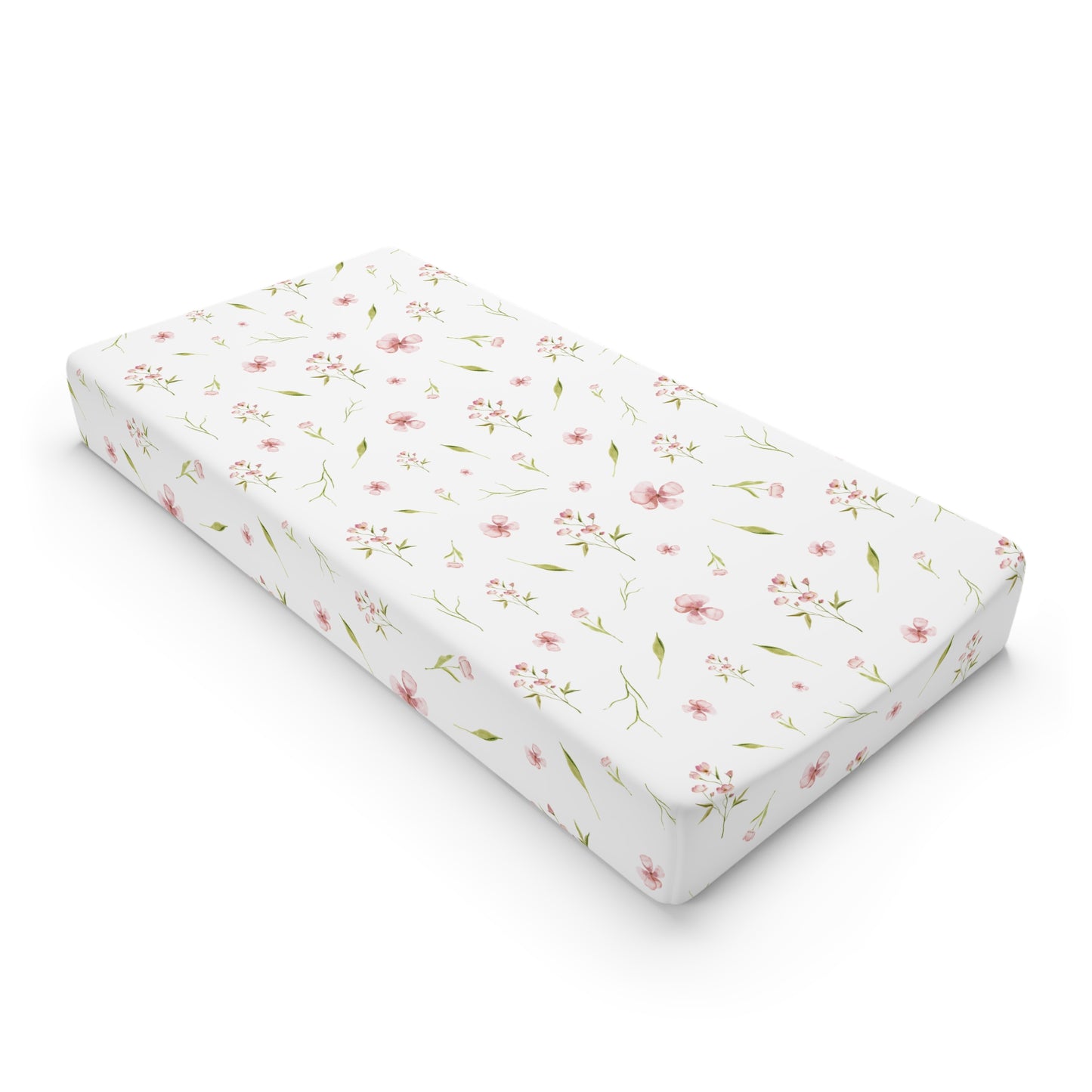 Blush Blossom changing pad cover on a nursery changing table