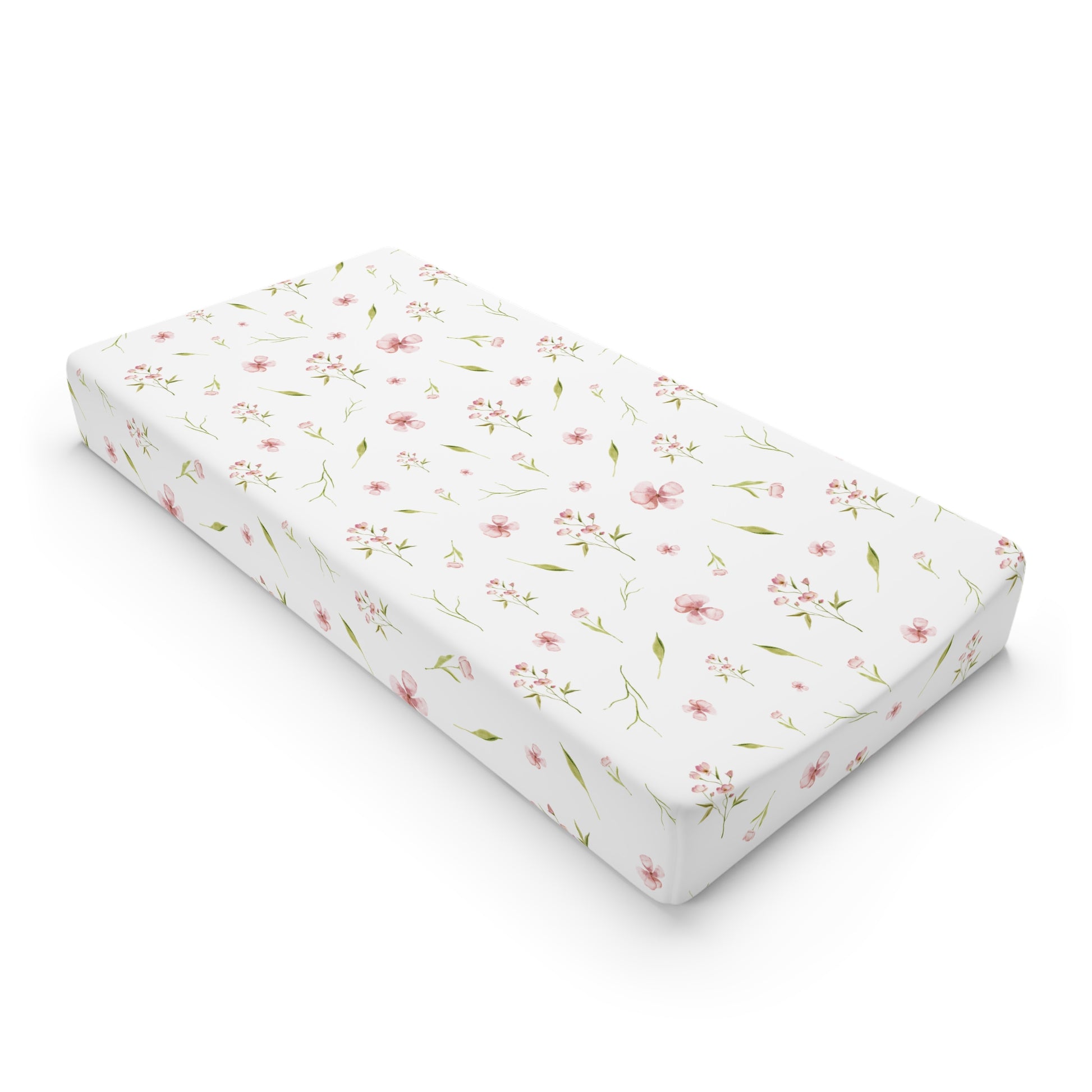 Blush Blossom changing pad cover on a nursery changing table