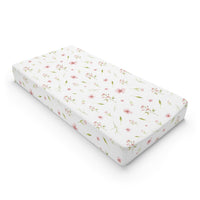 Blush Blossom changing pad cover on a nursery changing table