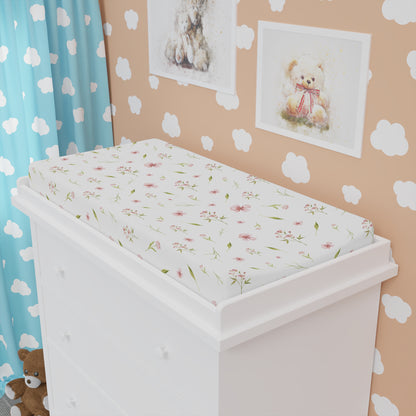 Pink floral changing pad cover matching the nursery crib sheet