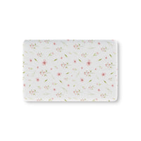 Blush Blossom fitted crib sheet on a nursery crib mattress