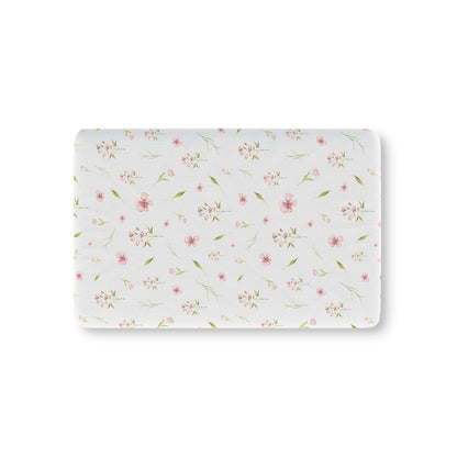 Blush Blossom fitted crib sheet on a nursery crib mattress