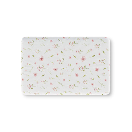 Blush Blossom fitted crib sheet on a nursery crib mattress