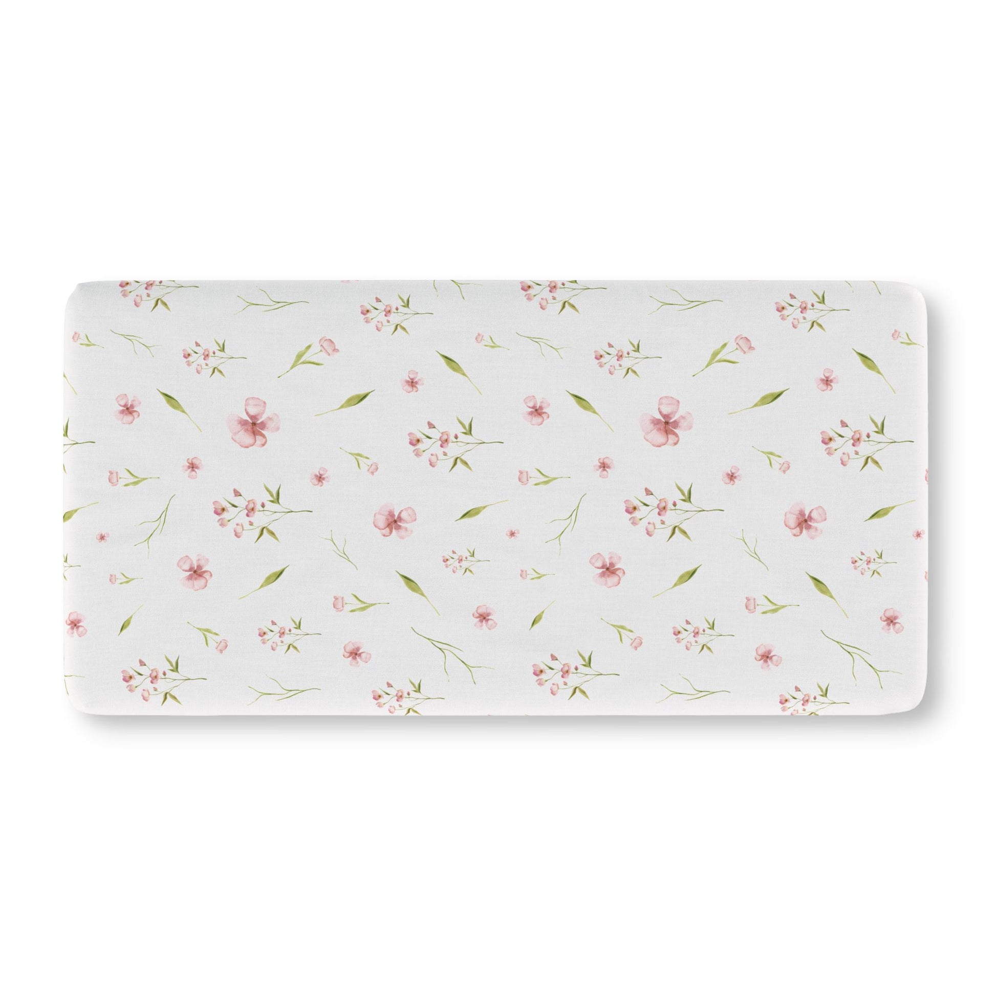 Pink watercolour floral crib sheet on a standard crib mattress
