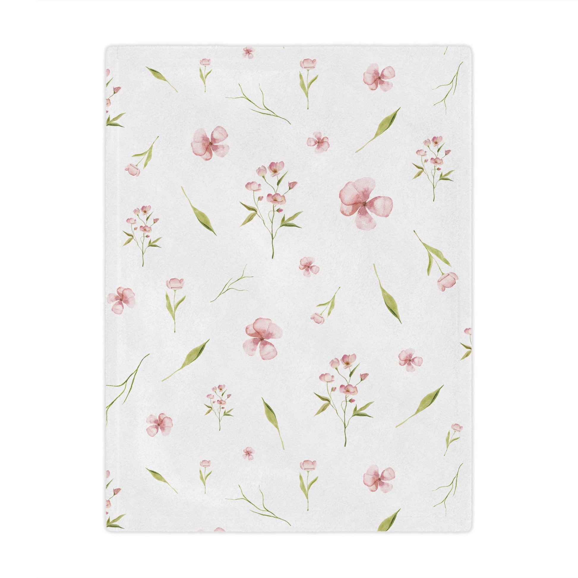 Pink watercolour floral minky baby blanket in a nursery