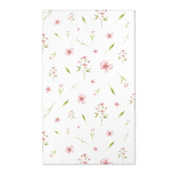 Pink floral nursery area rug with watercolour blooms on white
