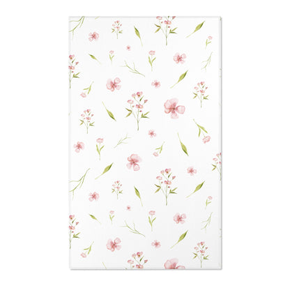 Pink floral nursery area rug with watercolour blooms on white