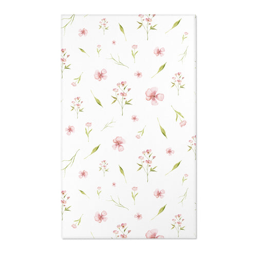 Pink floral nursery area rug with watercolour blooms on white
