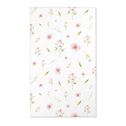 Pink floral nursery area rug with watercolour blooms on white