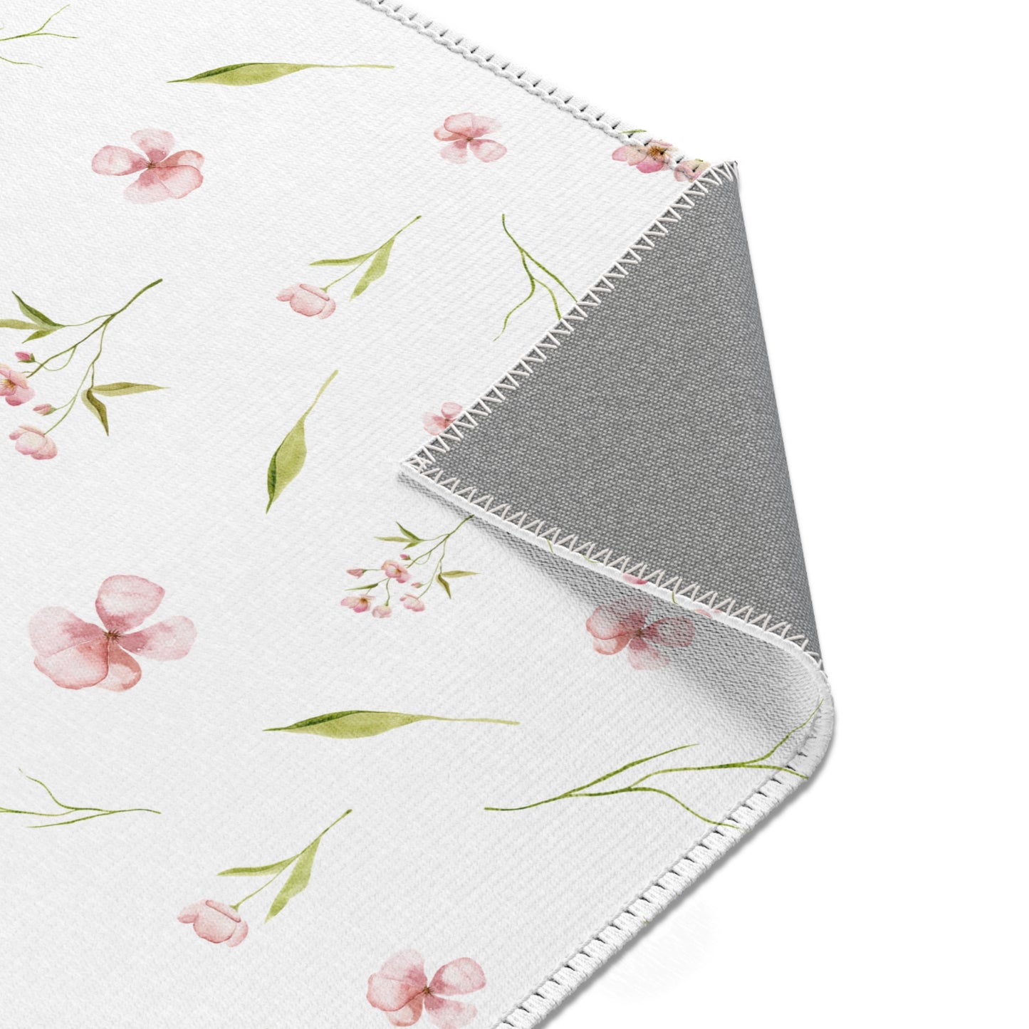 Blush Blossom nursery rug with a scattered watercolour print