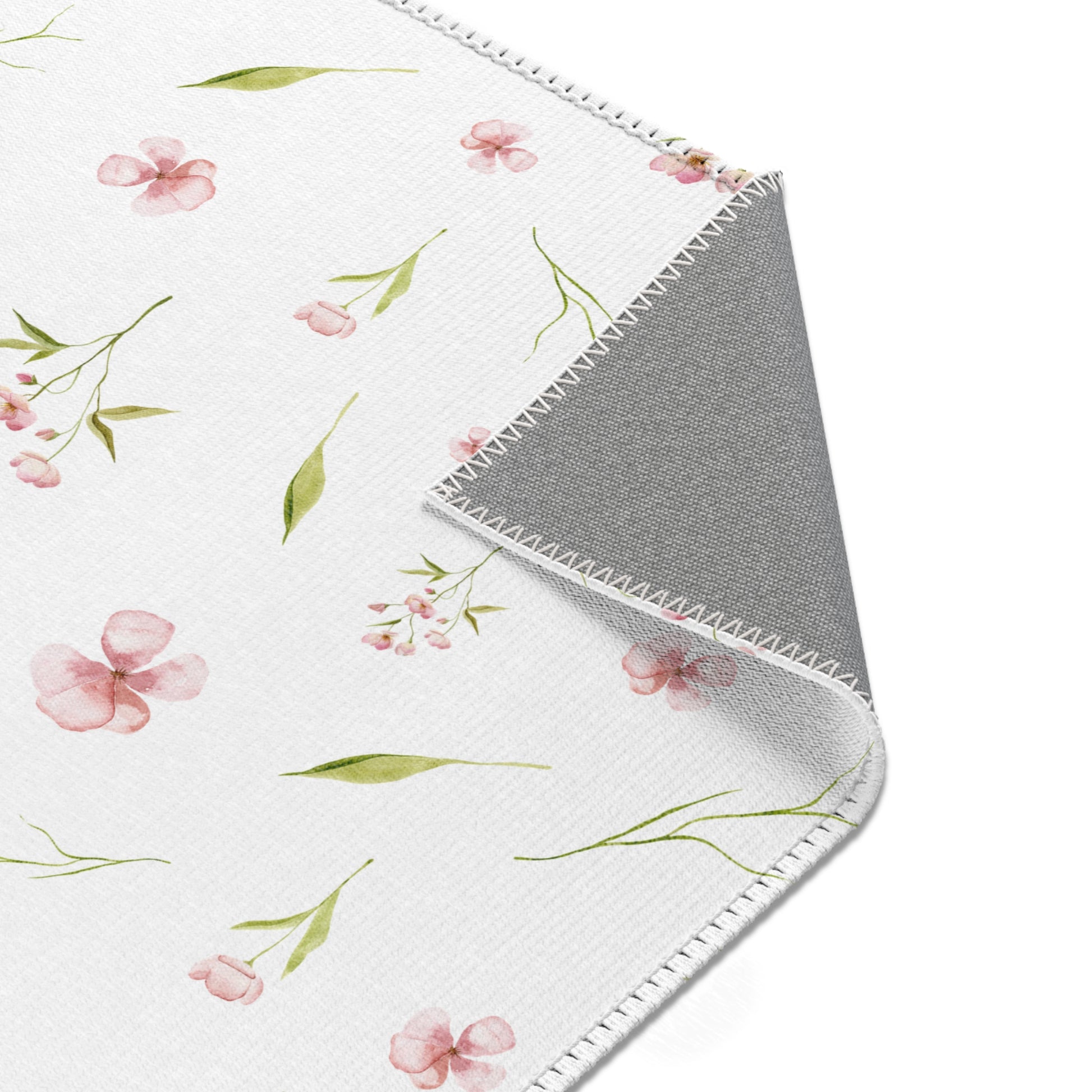 Blush Blossom nursery rug with a scattered watercolour print