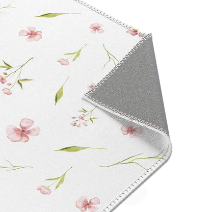 Blush Blossom nursery rug with a scattered watercolour print