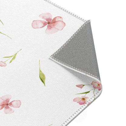 Watercolour blossom nursery rug in a girl's baby room