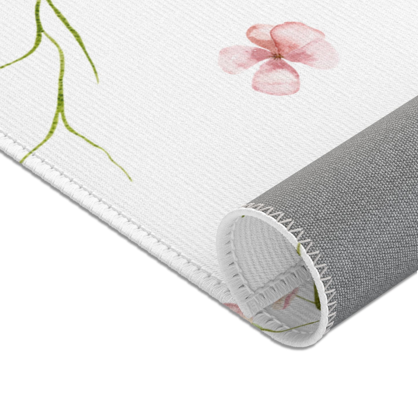Blush Blossom area rug shown in a nursery play area