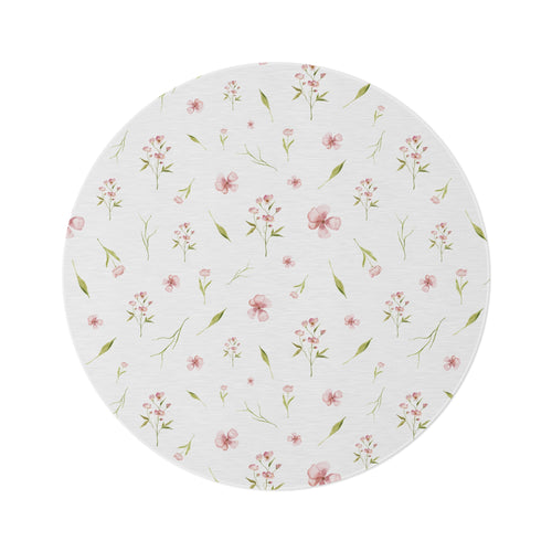 Blush Blossom round nursery rug on a baby girl's bedroom floor