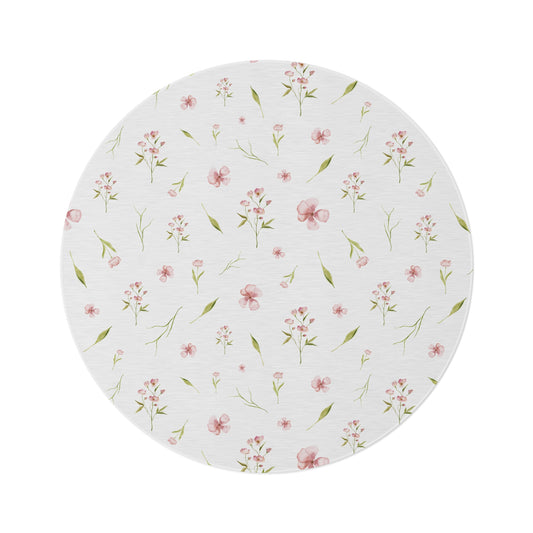 Blush Blossom round nursery rug on a baby girl's bedroom floor
