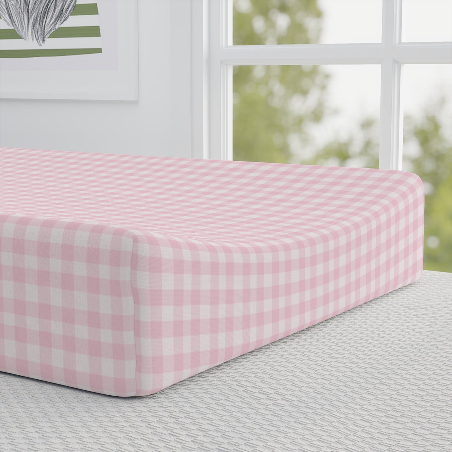 Blush Gingham pad cover matching the nursery crib sheet