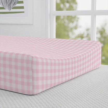 Blush Gingham pad cover matching the nursery crib sheet