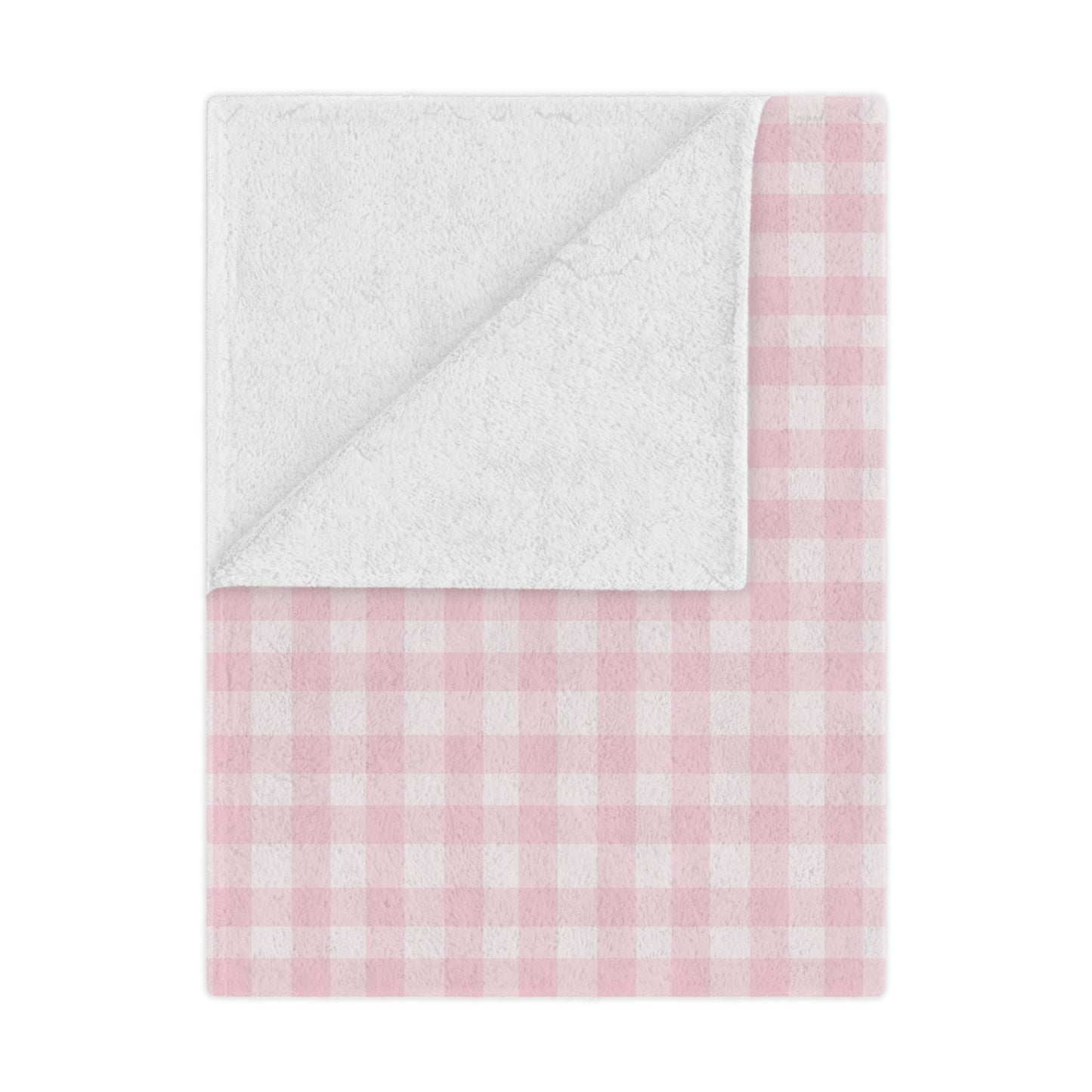 Blush Gingham minky baby blanket draped over a crib