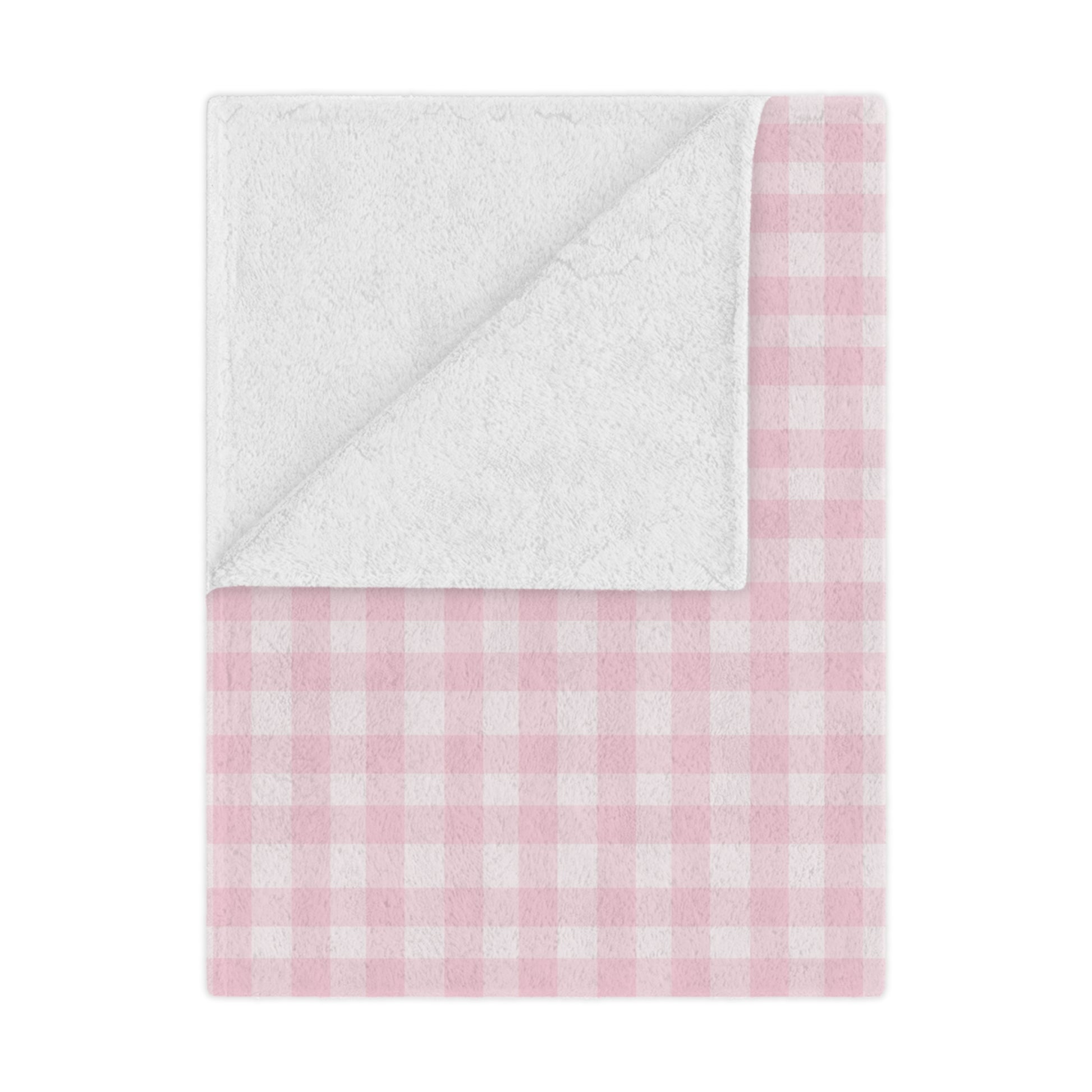 Blush Gingham minky baby blanket draped over a crib
