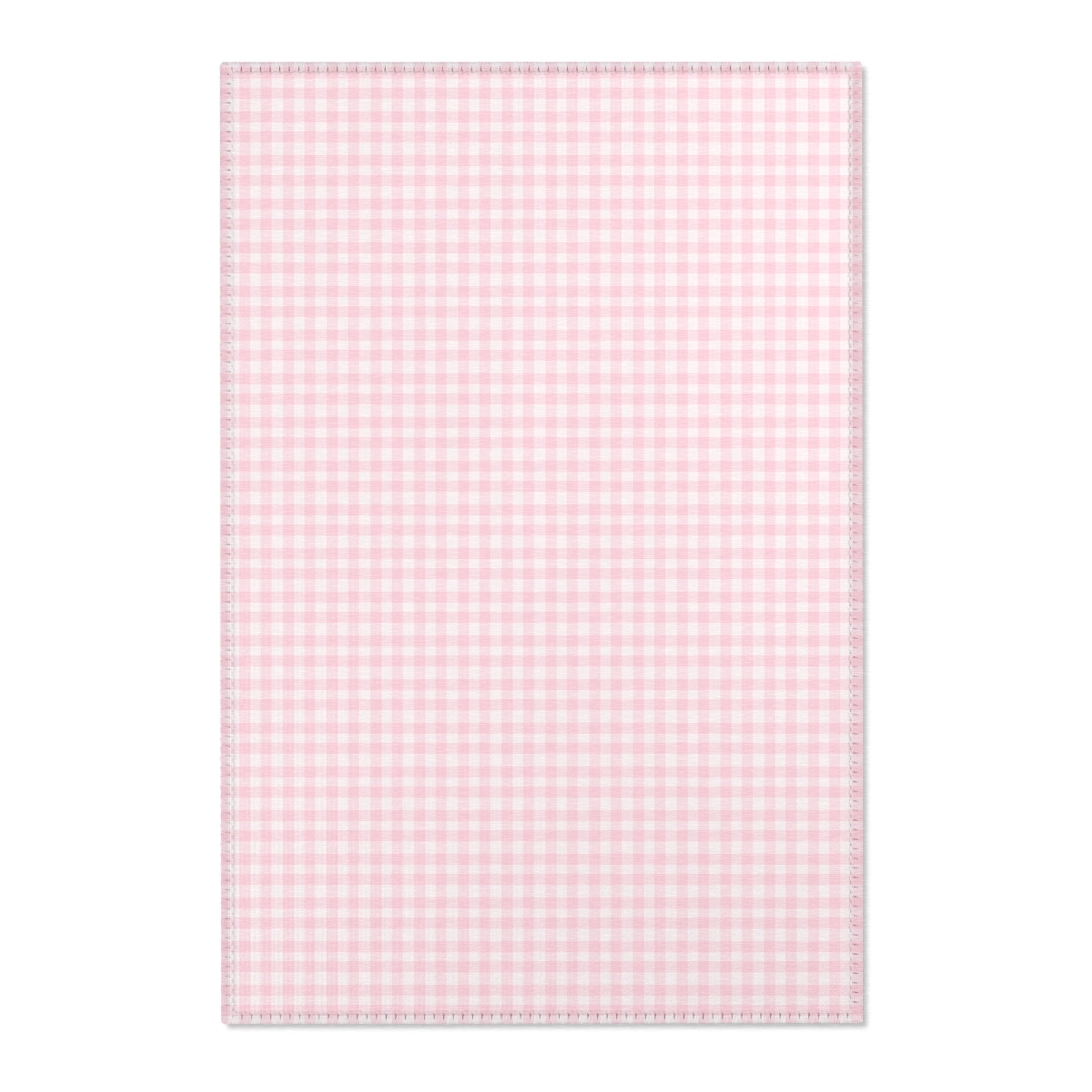 Blush Gingham nursery area rug in a baby girl's bedroom