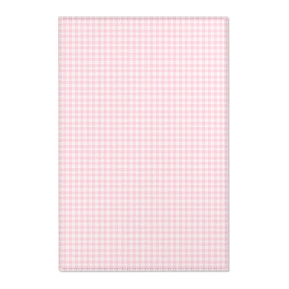 Blush Gingham nursery area rug in a baby girl's bedroom