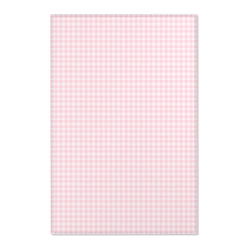 Blush Gingham nursery area rug in a baby girl's bedroom