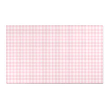 Blush Gingham area rug on a light wood floor