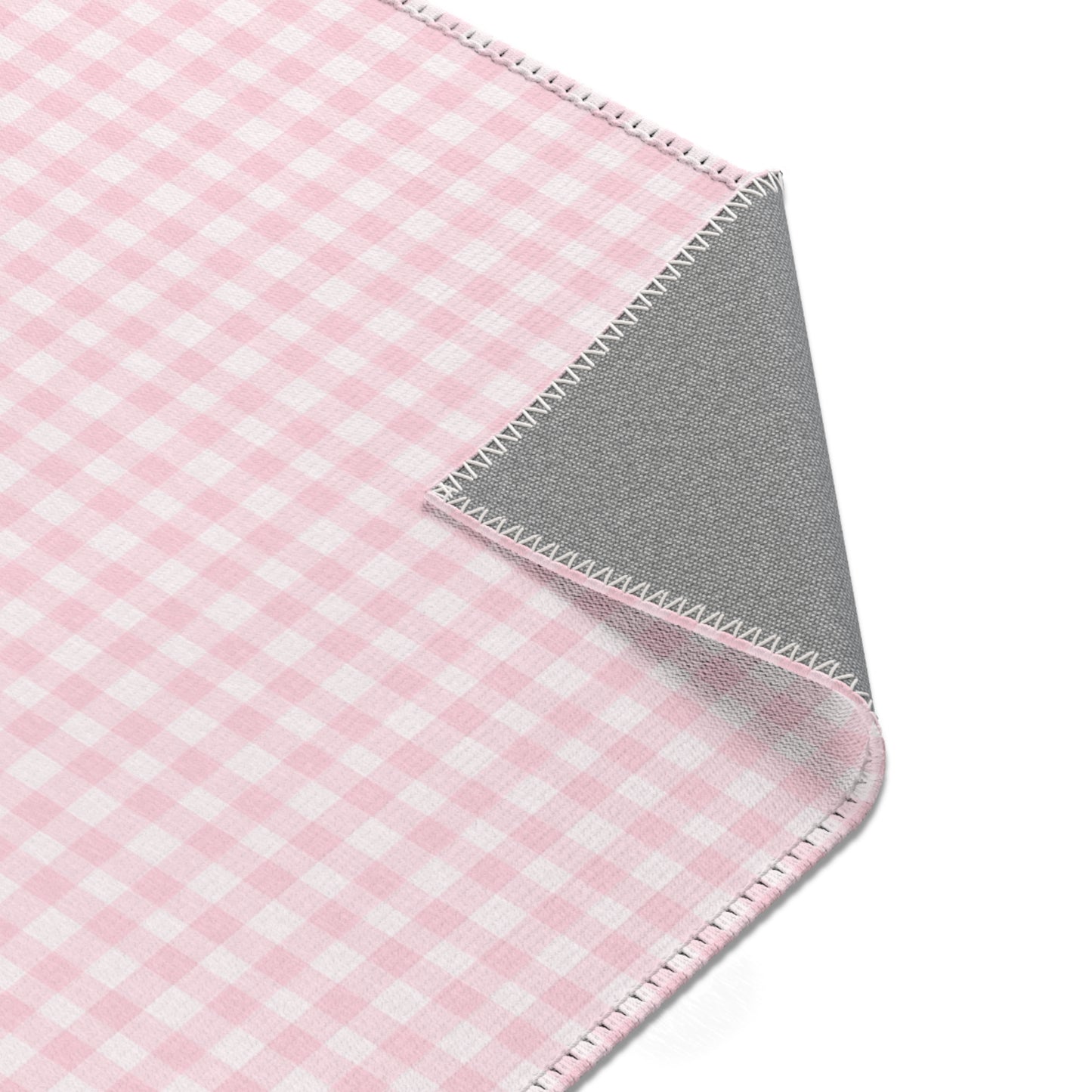 Blush Gingham rug in a baby girl's nursery