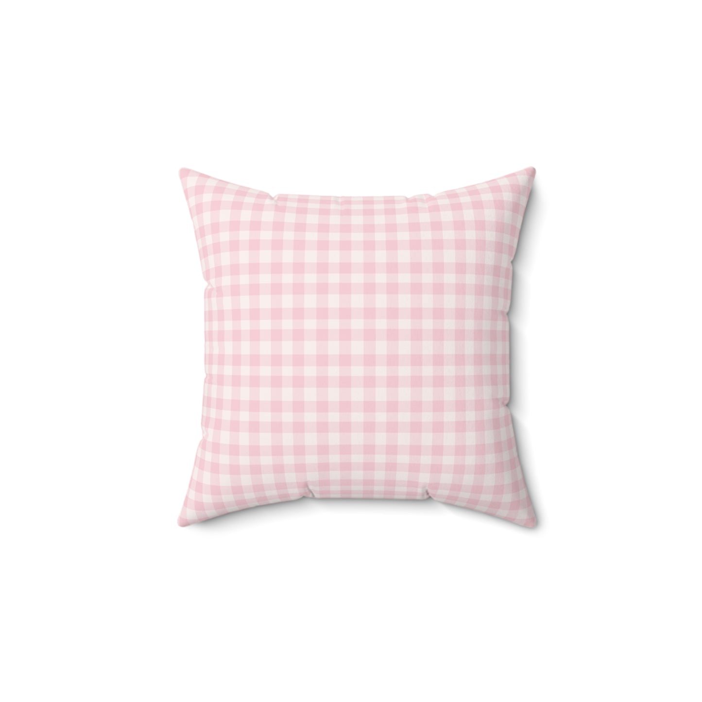 Blush Gingham decorative nursery pillow on a glider chair