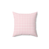 Blush Gingham decorative nursery pillow on a glider chair