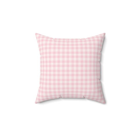 Blush Gingham decorative nursery pillow on a glider chair