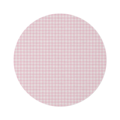 Blush Gingham round nursery rug on a baby room floor