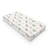 Boho Botanical changing pad cover on a nursery changing table