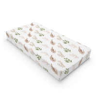 Boho Botanical changing pad cover on a nursery changing table
