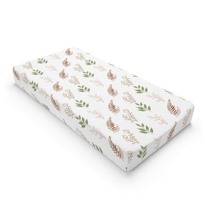Boho Botanical changing pad cover on a nursery changing table