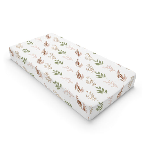 Boho Botanical changing pad cover on a nursery changing table