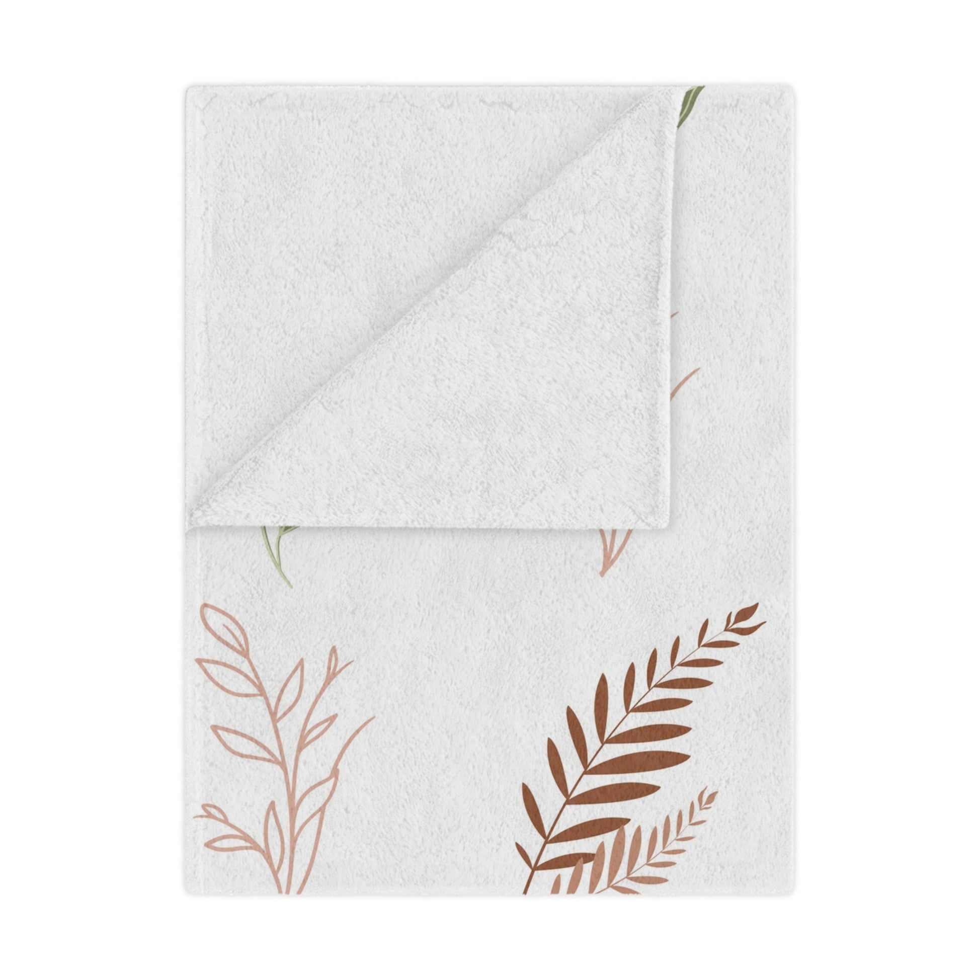 Boho Botanical minky baby blanket draped over a crib