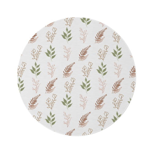 Boho Botanical round nursery rug on a baby room floor