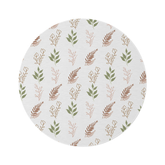 Boho Botanical round nursery rug on a baby room floor