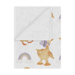 Bonnet Ducklings minky baby blanket draped over a crib
