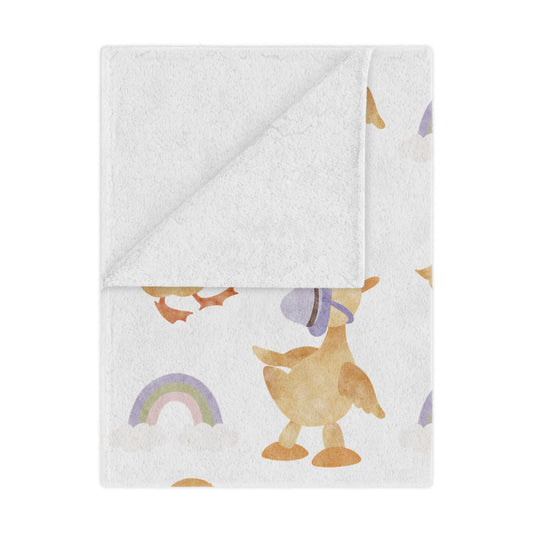 Bonnet Ducklings minky baby blanket draped over a crib