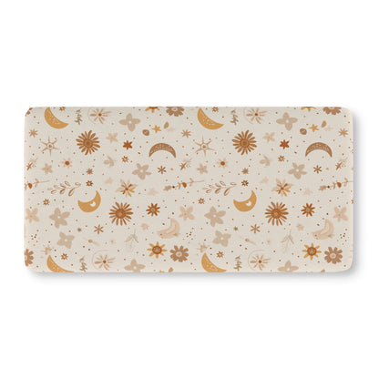 Fitted crib sheet with golden moons and rust florals on cream