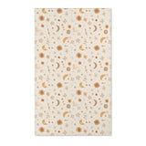 Moon and floral nursery area rug in gold, rust and tan