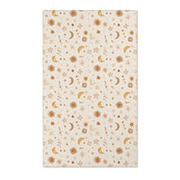 Moon and floral nursery area rug in gold, rust and tan