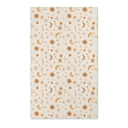 Moon and floral nursery area rug in gold, rust and tan