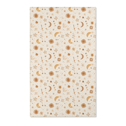 Moon and floral nursery area rug in gold, rust and tan